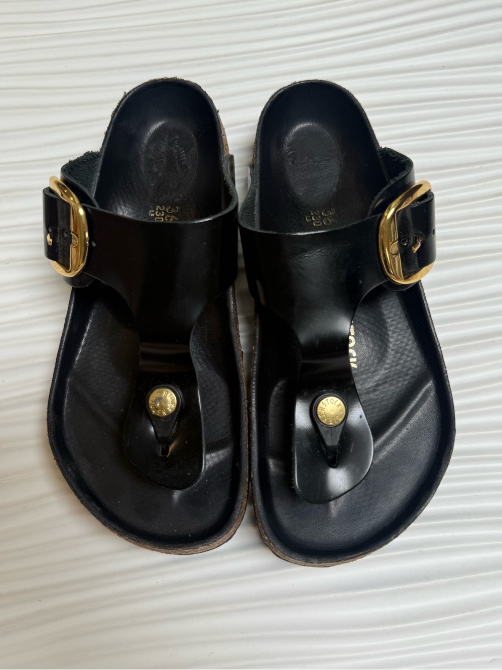 Birkenstock Gizeh Big Buckle sandals in a high-shine black patent leather finish